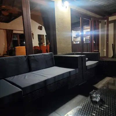 a living room with a couch and a table at Damani Lodge at Zebula Golf Estate and Spa in Warmbaths
