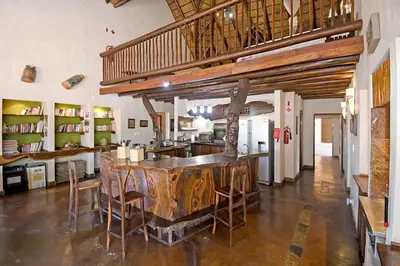 a kitchen with a large island in the middle of a room at Damani Lodge at Zebula Golf Estate and Spa in Warmbaths