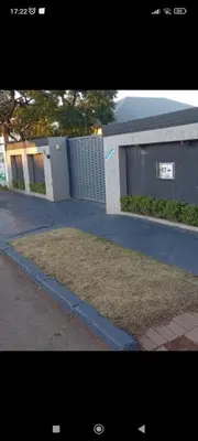 a picture of a building with a driveway at The Croc Backpackers in Springs