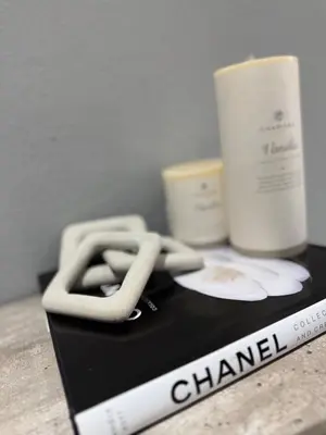a close up of a closed book with a candle and a rope at Glowti Event & Guest House in Centurion
