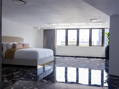 a bedroom with a bed and a glass floor at Pent Lucius - 3 bedroom Penthouse in Pretoria