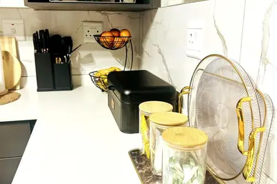 a kitchen counter with a fan and other kitchen items at Cozy Carlswald EXcape in Midrand