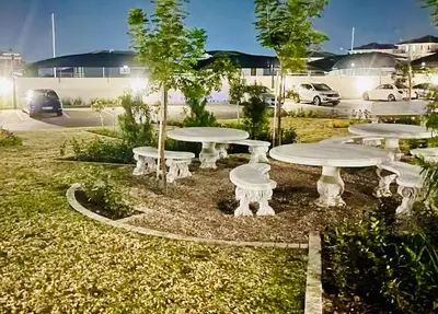 a group of white picnic tables in a park at Cozy Carlswald EXcape in Midrand