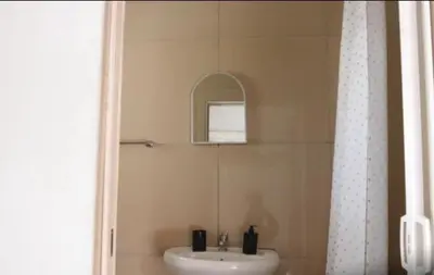 a bathroom with a sink and a shower at 54 River Logde in Mokopane