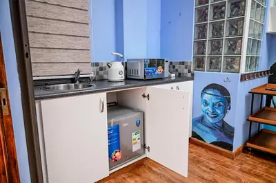 a kitchen with a counter top with a sink and a counter at CasaRegalo180 in Pretoria