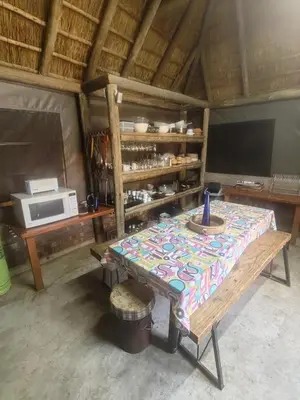a table with a table cloth on it in a room at Aloe Bush Game Lodge in Marble Hall