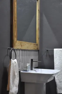 a bathroom with a white sink and a mirror at StayFit 06 in Polokwane