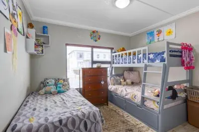 a childs bedroom with two beds and a dresser at 231 Whisken Ave, Crowthorne Ah in Midrand