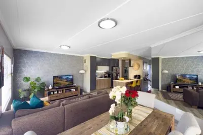 a living room with a couch and a table at 231 Whisken Ave, Crowthorne Ah in Midrand