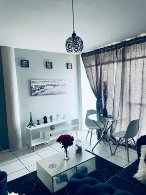a living room with a couch and a table at Cloud 10 Hideaway in Pretoria