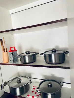 three pots on a stove in a kitchen at Cloud 10 Hideaway in Pretoria