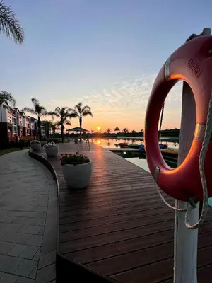 a wooden boardwalk with a large lifesaver on it at The Blyde Crystal lagoon 3-bed entire apartment in Pretoria