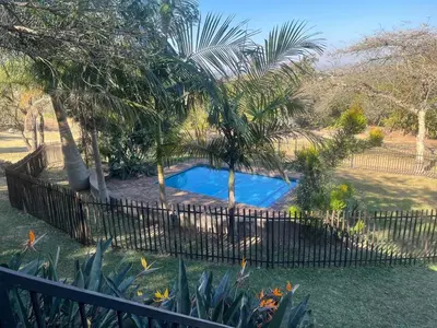 a fence around a swimming pool in a yard at 7 on Bellevue in White River