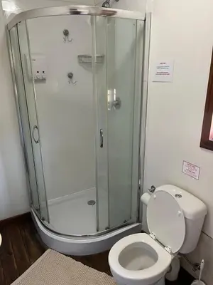 a bathroom with a shower and a toilet at 7 on Bellevue in White River