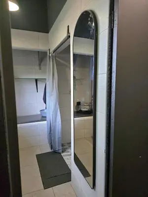 a bathroom with a mirror and a shower at Sunset View in Pretoria