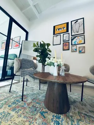 a living room with a coffee table and a couch at Menlyn Luxe Stay 1BR, Free Parking in Pretoria