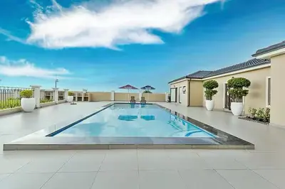 a large swimming pool in the middle of a courtyard at Luxury Lakeview Stay With Workspace in Midrand