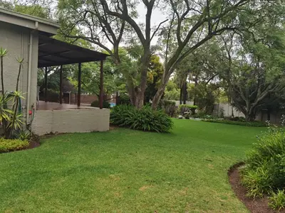 a yard with a green lawn with a gazebo at No 24 Allan Road in Midrand