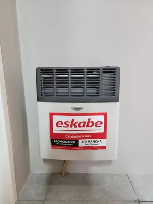 a radiator in a wall with a sign on it at Secret pillow in Trichardt
