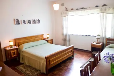 a bedroom with two beds and a window at Luisa's Place in Pretoria