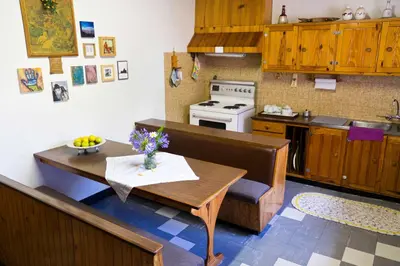 a kitchen with a table and a kitchen with a stove at Luisa's Place in Pretoria