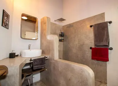 a bathroom with a sink and a mirror at Leadwood Marloth Lodge in Marloth Park
