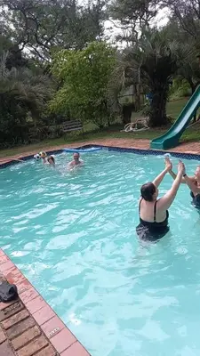 a group of people in a swimming pool at Afpak in Barberton
