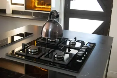 a tea kettle on top of a stove in a kitchen at watershed Self catering in Phalaborwa