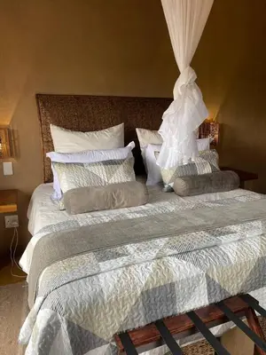 a bedroom with two beds with pillows on it at Zebula - African Dream A - Pax 8 in Warmbaths