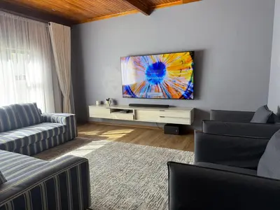 a living room with a flat screen tv on a wall at Bendor Escape - Peace Privacy Power in Polokwane