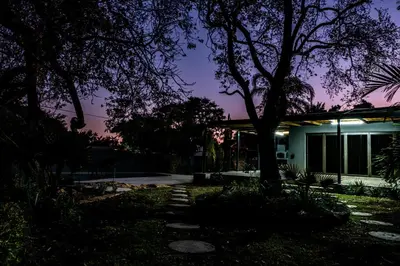 a house with a tree in front of it at night at Bendor Escape - Peace Privacy Power in Polokwane