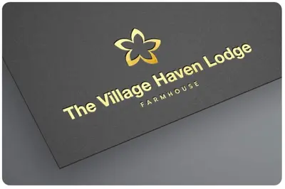 a black card with the villagehaven lodge logo on it at The Village Haven Lodge