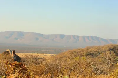 a view of a hill with mountains in the background at Bushtime at Mabula in Bela-Bela