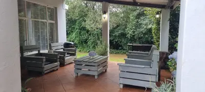 a group of beehives sitting on a patio at DullVino Wellington House in Dullstroom