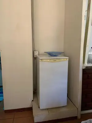 a small refrigerator with a bowl on top of it at Epizone in Mokopane