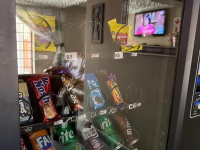 a vending machine filled with different types of chips at Wonder House Lodge in Mokopane