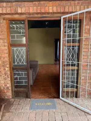 an open door in a brick building with a doorway at Garden Unit in Pretoria