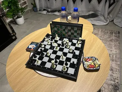 a chessboard on a table with bottles of water on top at Double Bed in the Capital City in Pretoria