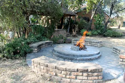 a fire pit in the middle of a yard at Ndlovu 41 inside the Dinokeng Big 5 Game Reserve in Dinokeng Game Reserve