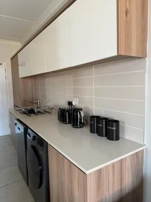 a kitchen counter with pots and pans on it at The Dream Stay At The Blyde - Suite 1 in Pretoria