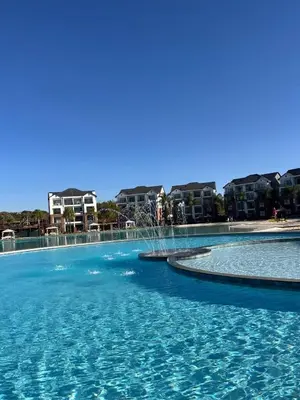 a large pool with blue water in front of some buildings at The Dream Stay At The Blyde - Suite 1 in Pretoria