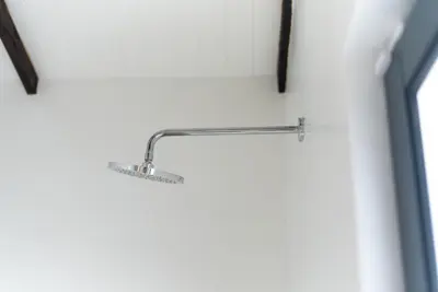 a metal towel rack on a white wall at Thuhlo in Marloth Park