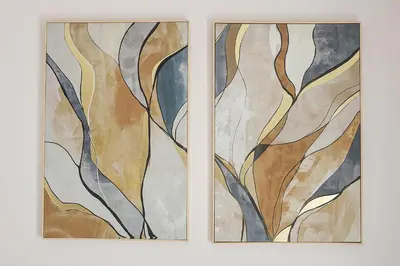 two pieces of art on a wall at Kamotha Guest House