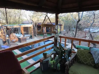 a view of a house with a fence at Unique Kruger Hide & Spa in Marloth Park