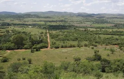 an overhead view of a field with a giraffe at Eagles View in Hartbeespoort