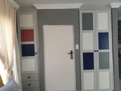 a room with a door with blue and white paint at Cuse guest house in Polokwane