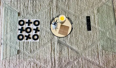an overhead view of a table with a candle and a plate at The Minimalist Hideout in Midrand