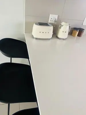 a counter with two toasters and a toaster at The Minimalist Hideout in Erand