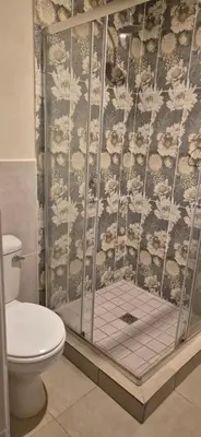 a bathroom with a shower with a toilet at Ekuhlaleni - A home away from home R8 in Pretoria