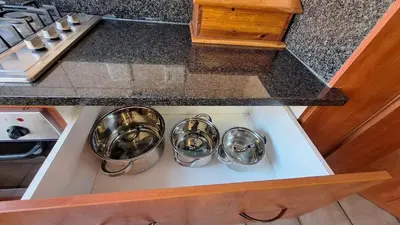 a kitchen with three pots on a stove top oven at 21 on Main in Benoni